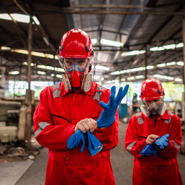 worker-wearing-safety-uniform-and-gas-mask-they-us-2025-03-15-22-11-06-utc
